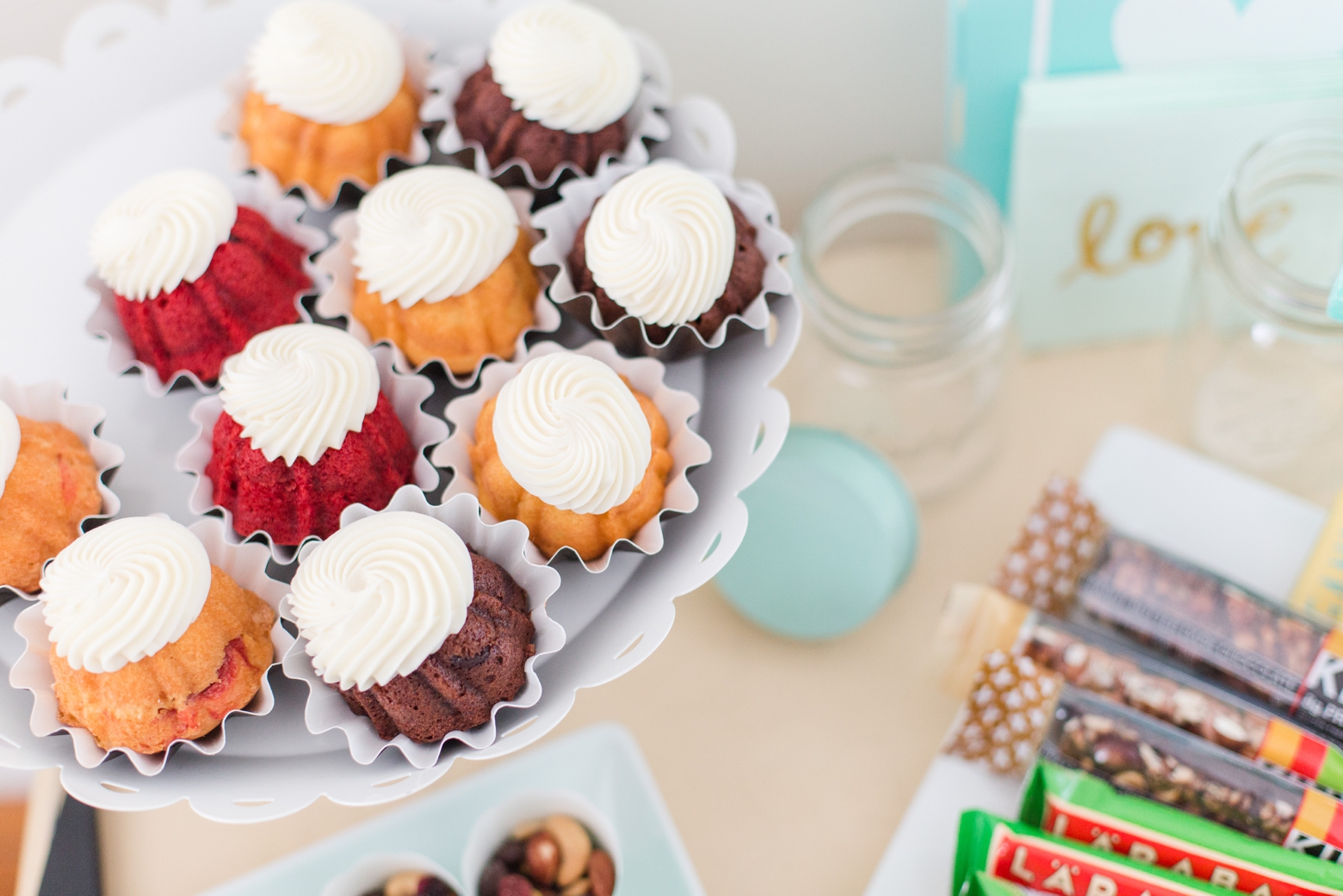 boutique owner branding photos with cupcakes